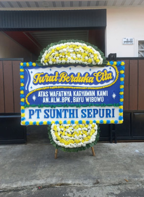 Papan Bunga Duka di Harapan Baru