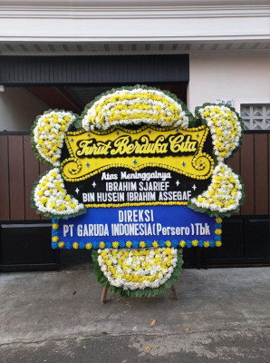 Papan Bunga Duka di Harapan Baru