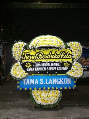 Papan Bunga Duka di Harapan Baru