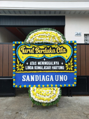 Papan Bunga Duka di Harapan Baru