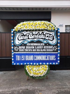 Papan Bunga Duka di Harapan Baru